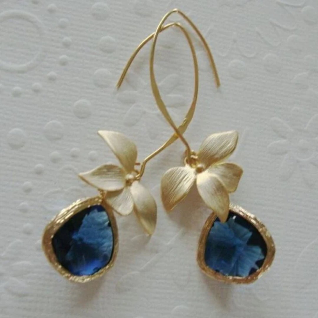 Pendientes dorados de flor con cristal azul - Hipnotelia