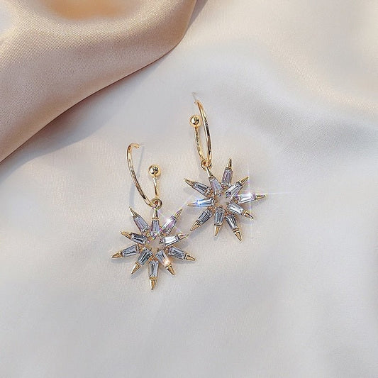 Pendientes de estrella brillante en dorado y plateado - Hipnotelia