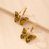 Cargar imagen en el visor de la galería, Pendientes dorados acrílicos de mariposa - Hipnotelia