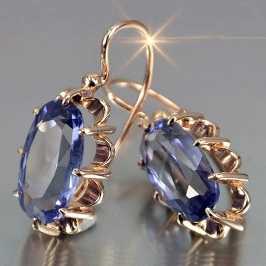 Pendientes dorados con óvalos de circonita azul - Hipnotelia