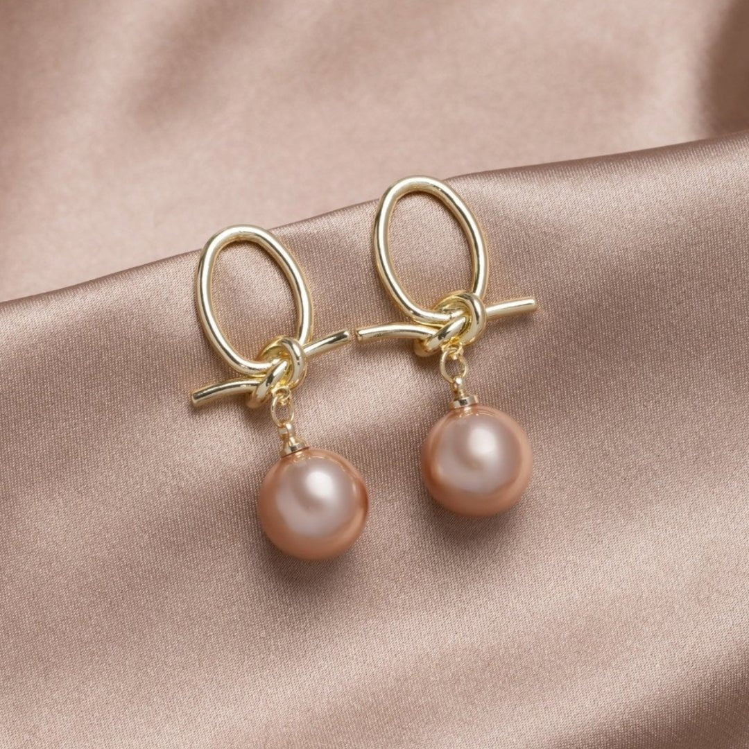 Pendientes dorados de lazos y perlas - Hipnotelia