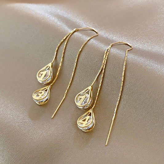 Pendientes dorados de números - Hipnotelia