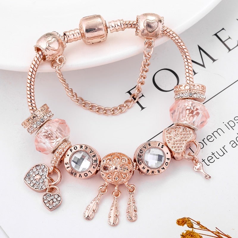 Pulsera rosada de atrapasueños con dijes incluidos - Hipnotelia