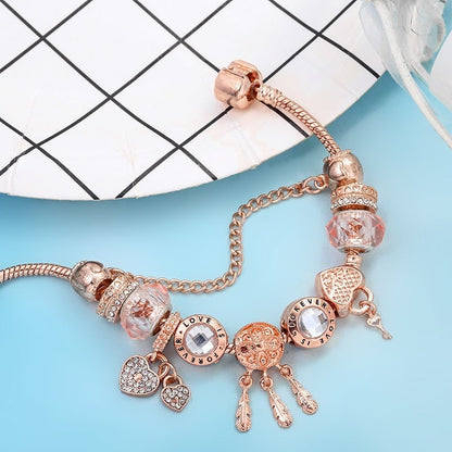 Pulsera rosada de atrapasueños con dijes incluidos - Hipnotelia