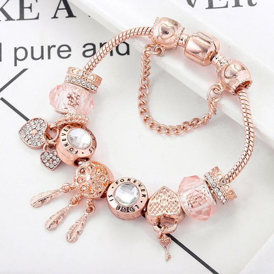 Pulsera rosada de atrapasueños con dijes incluidos - Hipnotelia
